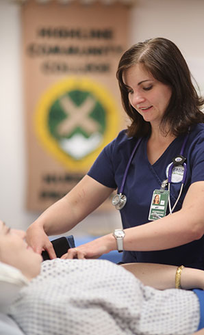 Highline College Nursing Student in lab checking blood pressure of student participant